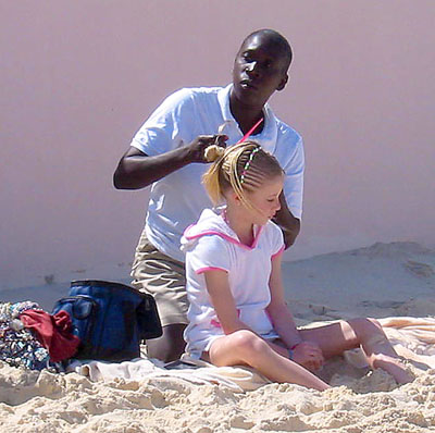 [ Girl getting braids ]