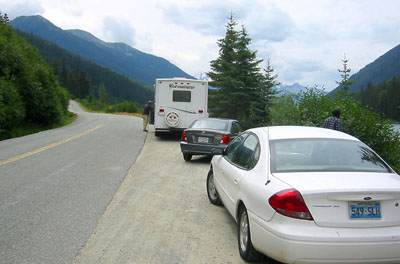 [ Cars stopped at the side of the road ]