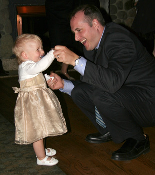 [ Morgan dances with daddy ]