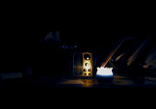 [ Candle on a desk ]