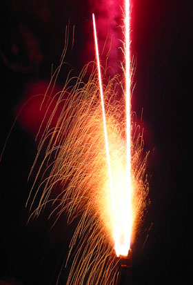 [ Fireworks going off ]