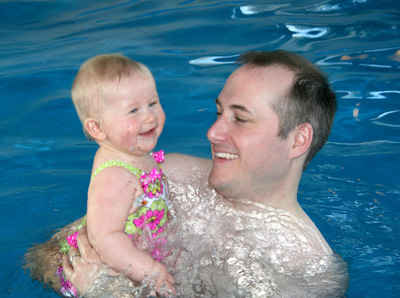 [ Morgan in the pool with daddy ]