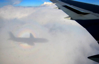 [ 
Shadow of the plane on the clouds ]