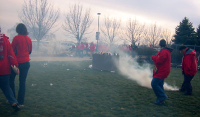 [ Smoke flares in the parking lot ]