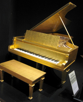 [ Elvis' gold piano ]