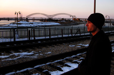 [ James looks over the Mississippi ]