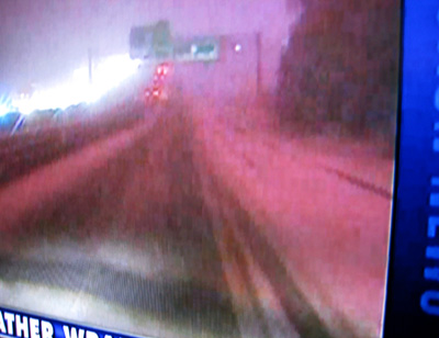 [ Evening news about the storm ]